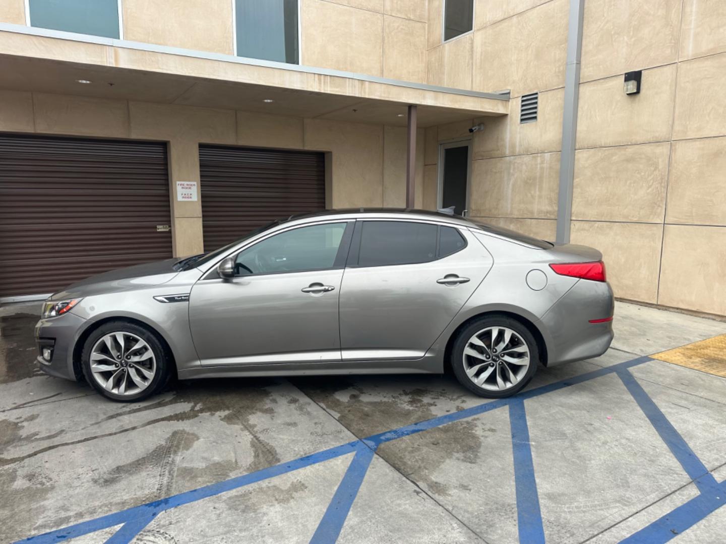 2014 Gray /BLACK Kia Optima SX Turbo (5XXGR4A62EG) with an 2.0L L4 DOHC 16V TURBO engine, 6-Speed Automatic transmission, located at 30 S. Berkeley Avenue, Pasadena, CA, 91107, (626) 248-7567, 34.145447, -118.109398 - New tires! Moon Roof! Nice Interior! Looks and drives good! Bad credit? We can help! We are the bank. All our cars are thoroughly inspected and reconditioned by our technicians. FREE CARFAX report. Stop by or call to speak with our friendly staff. Whether you have bad credit, no credit, bankruptcy, - Photo#1